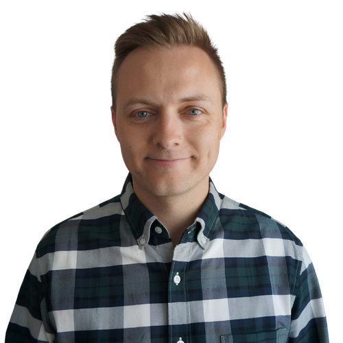 Brandon, who runs Finally Get AI, smiling in a plaid shirt
